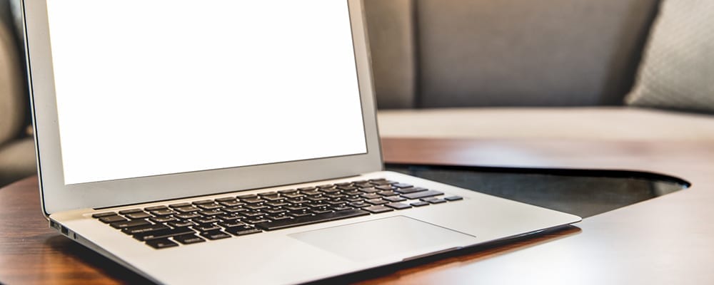 Laptop on a wooden table