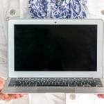 Woman holding laptop