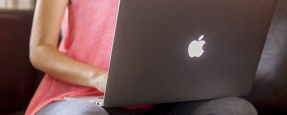 Woman using apple laptop